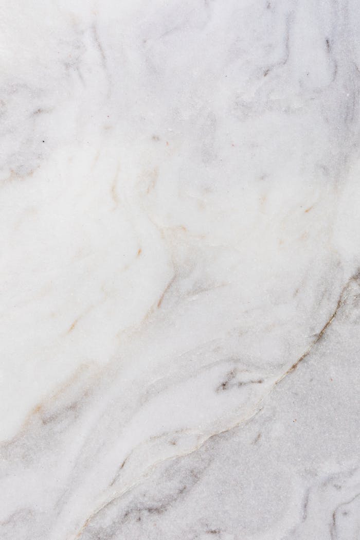 High-resolution white marble texture with natural patterns, ideal for design and architecture projects.